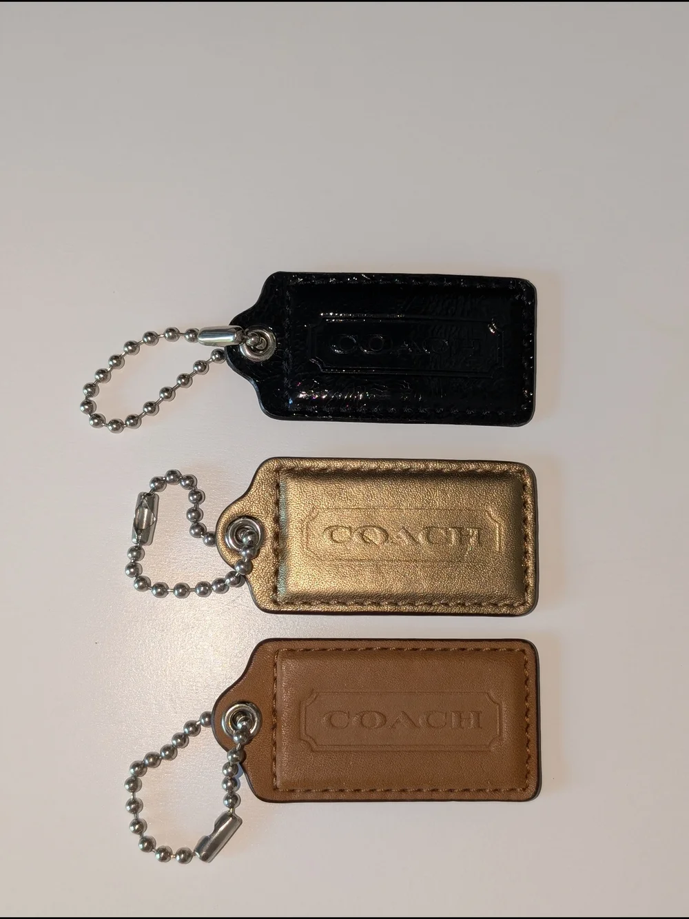 Coach Leather Hangtag Trio - Black, Gold, Brown